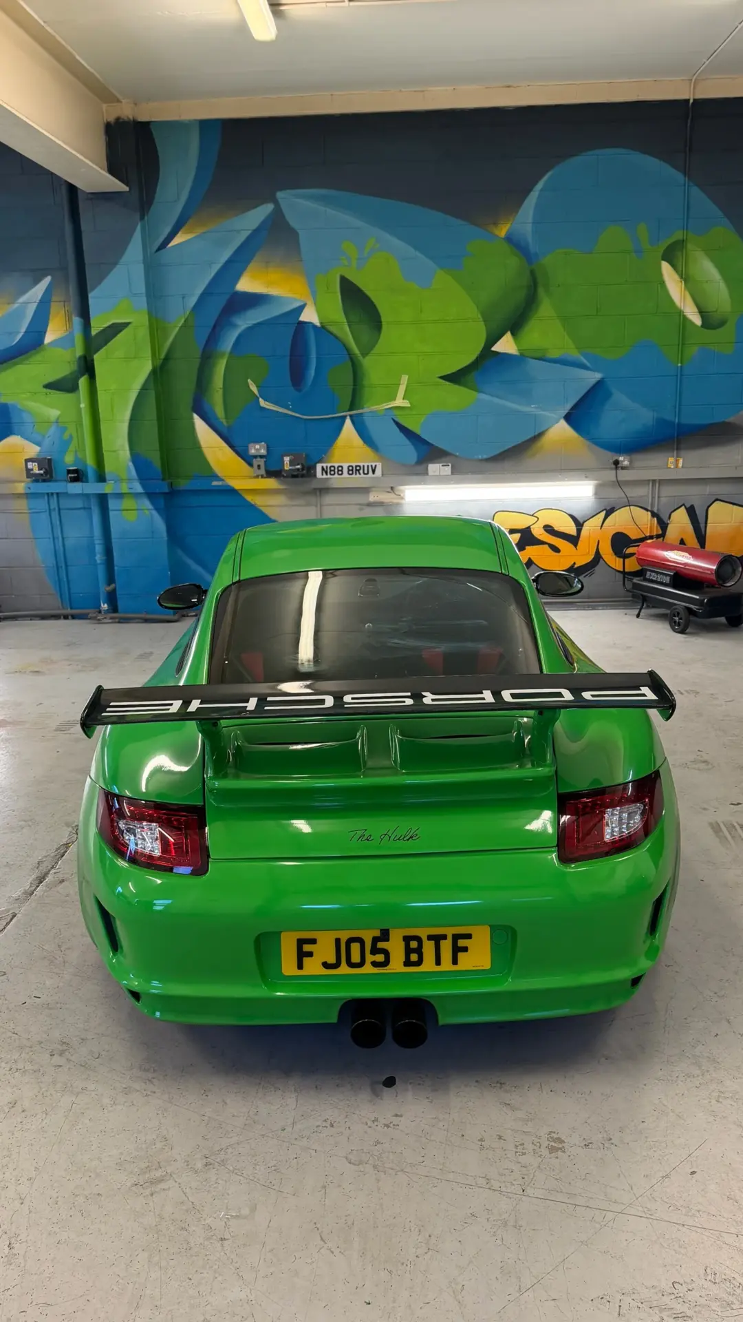 Porsche wrapped in green vinyl by Tauro Design