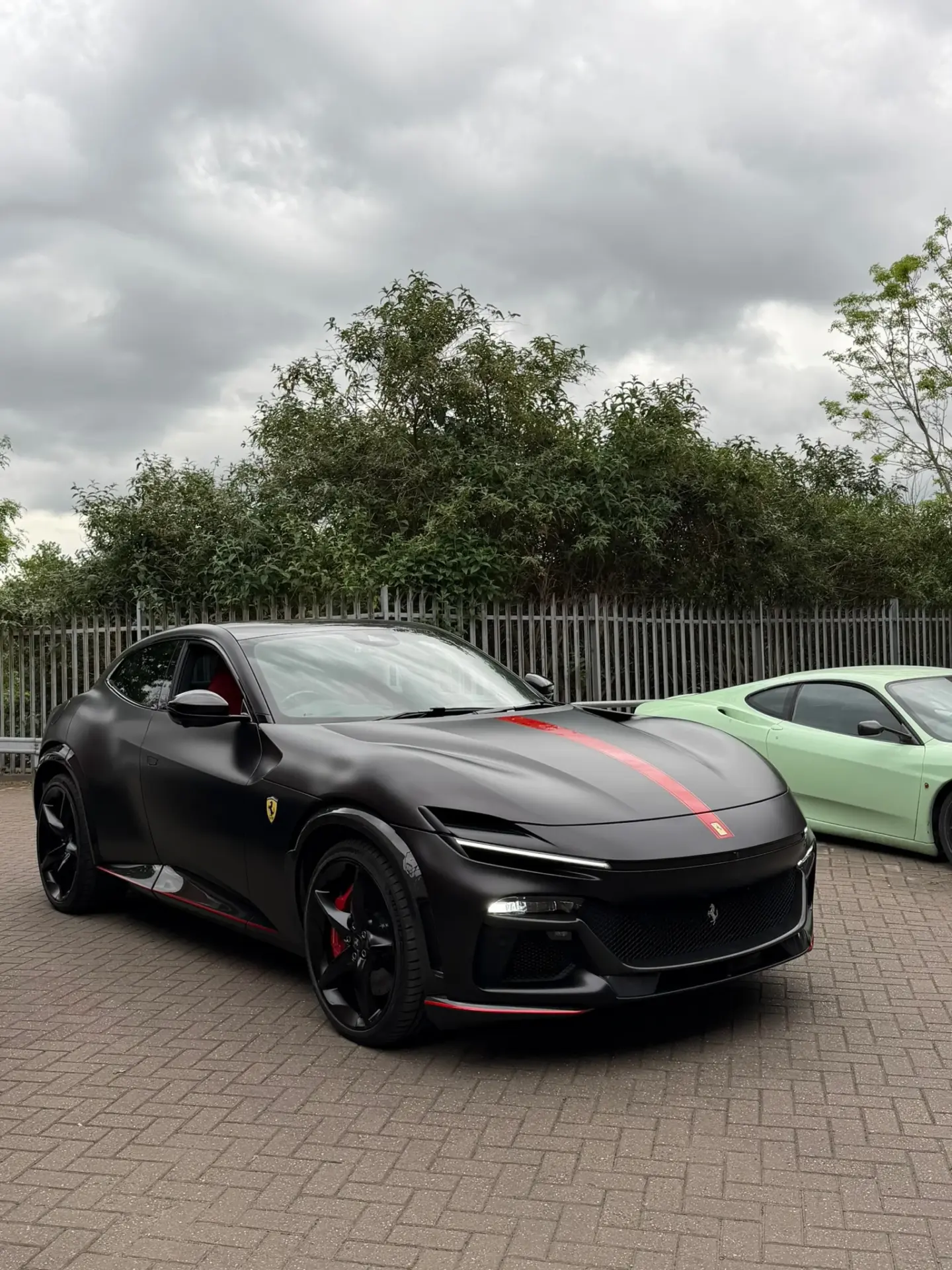 Ferrari Purosangue wrapped in satin black vinyl by Tauro Design