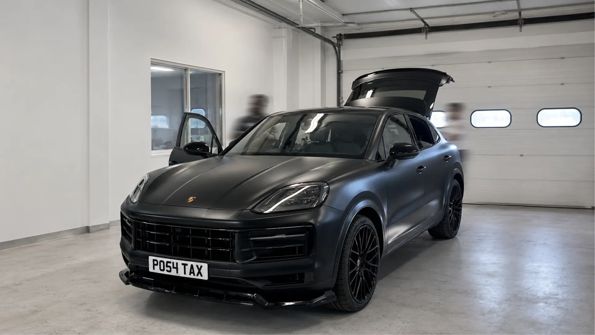 Porsche Cayenne Coupe wrapped in satin black vinyl by Tauro Design